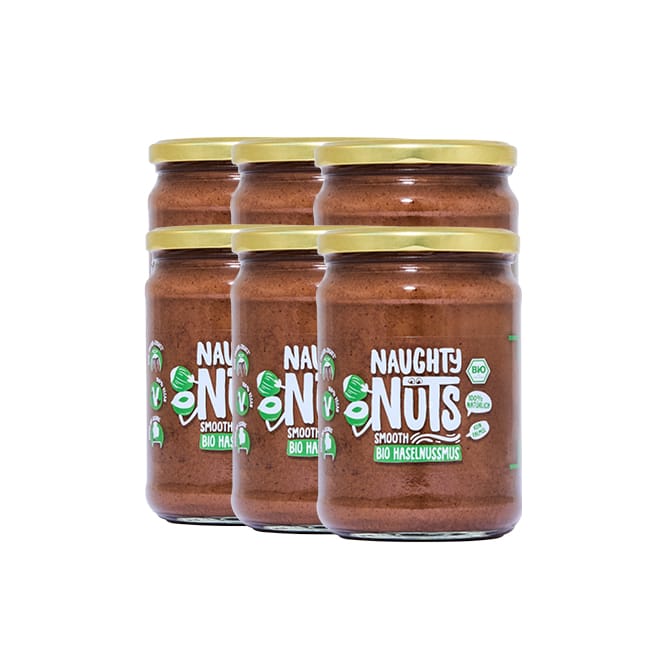 Sechs Gläser Bio Haselnussmus Smooth 500g mit goldenen Deckeln und grünen Etiketten