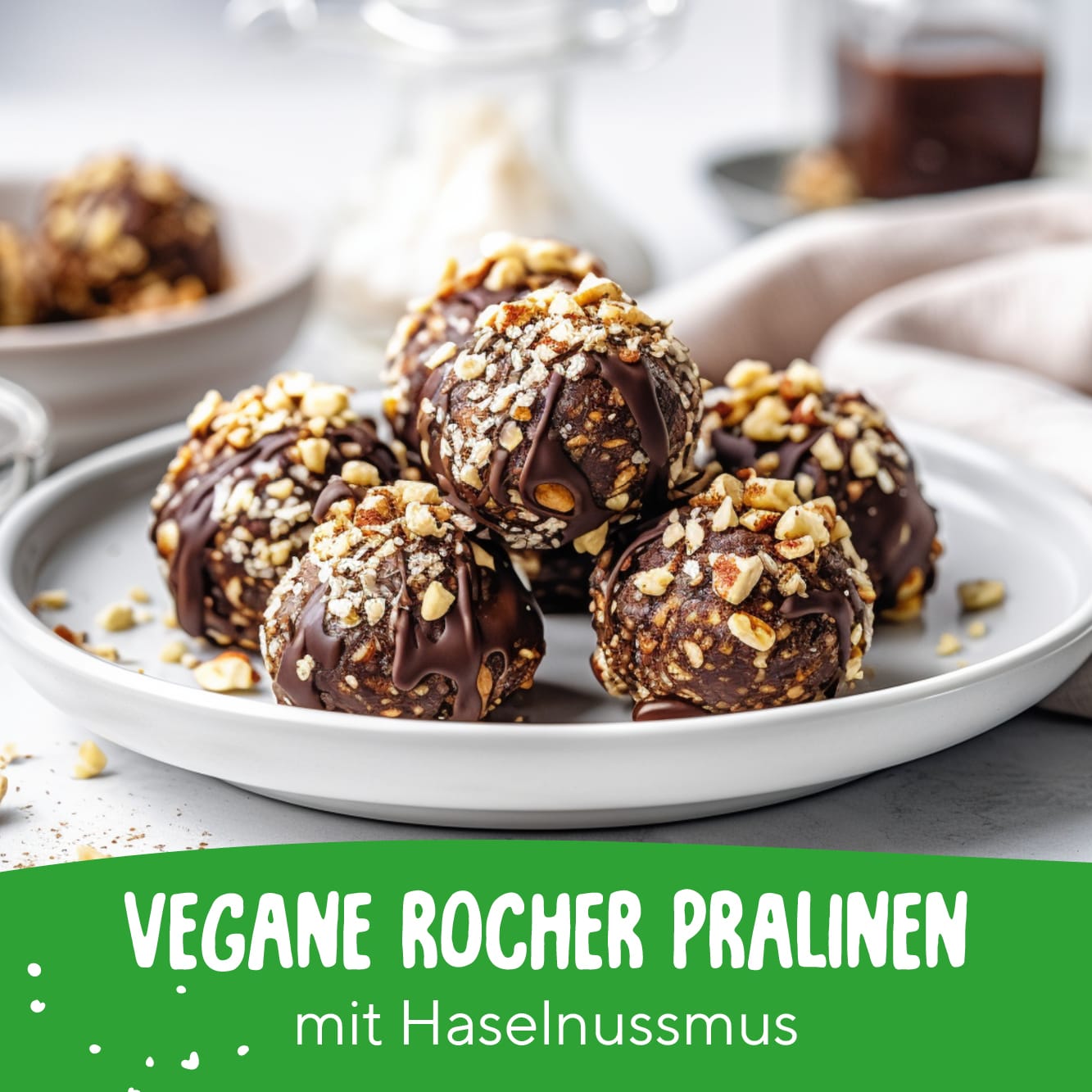 Vegane Rocher Pralinen mit Haselnussmus und Schokoladenüberzug auf einem weißen Teller